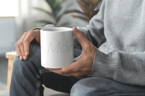 Man Holding White Coffee Mug Mockup for Graphics and Patterns